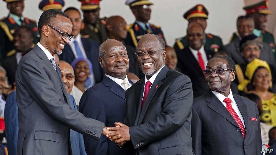 Kagame shakes Magufuli's hand, 2016