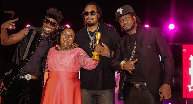 Juanita Kawalya Handed a Lifetime Achievement Award by both Bebe Cool,  Bobi Wine and Navio in 2015