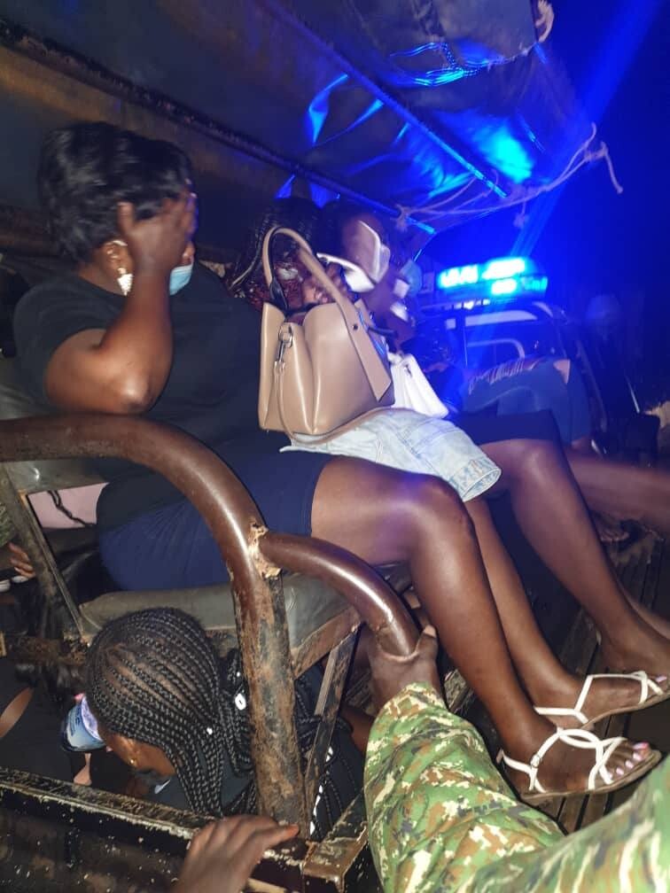 Ugandan women under arrest on a police pickup 