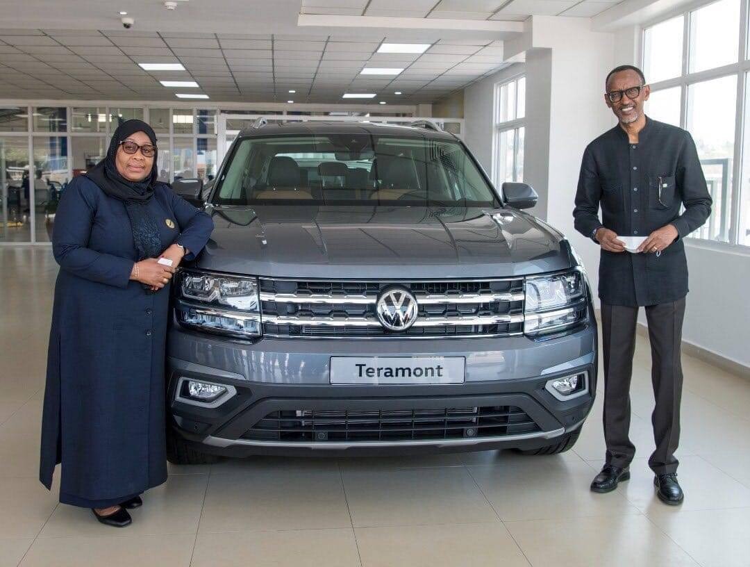 Presidents Samia and Kagame stand next to a Volkswagen Teramont model 