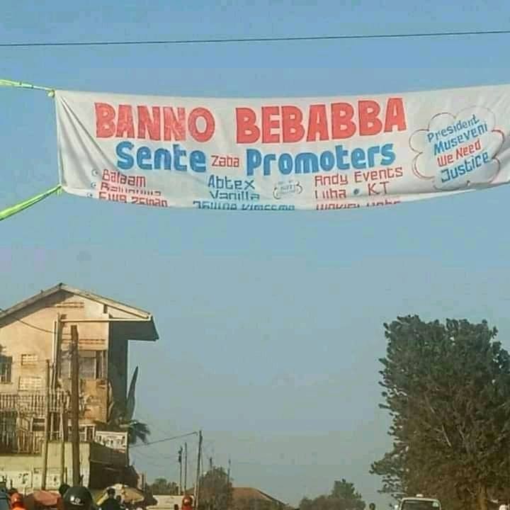 a cloth billboard showing some of the promoters who allegedly stole the money, was put up last week by some Ugandans