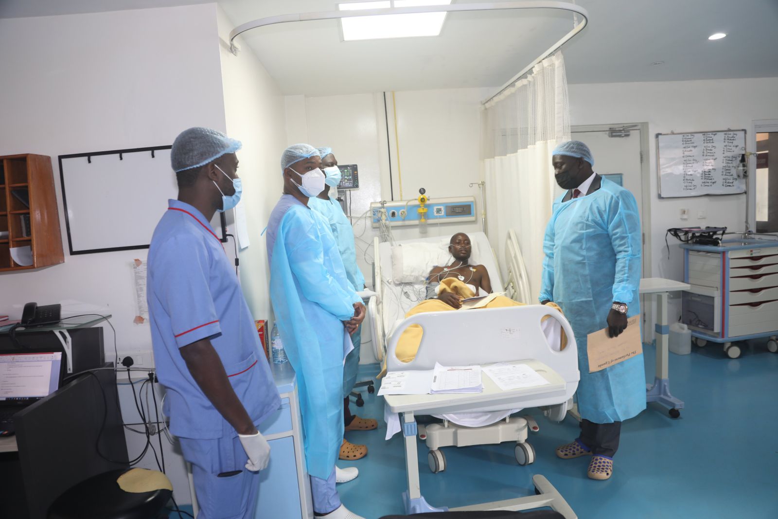 Commissioner of Parliament, Hon. Solomon Silwanyi in Jan, 2022 delivers message of encouragement to Police constable Robert Mukebezi who was shot while on duty