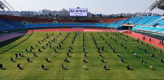 Job Applicants in South Korea sit aptitude test in a stadium