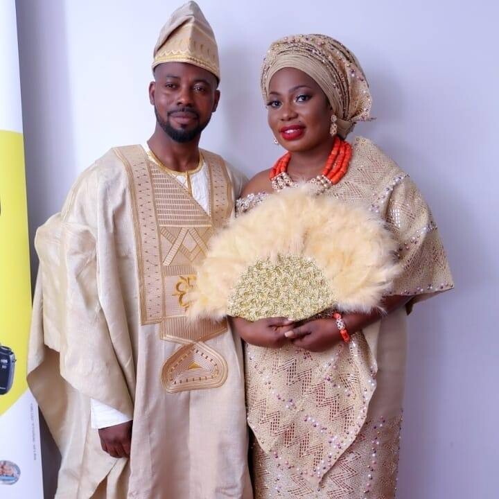 Ritah and her husband, Joseph on their wedding day dressed in traditional Nigerian wear 