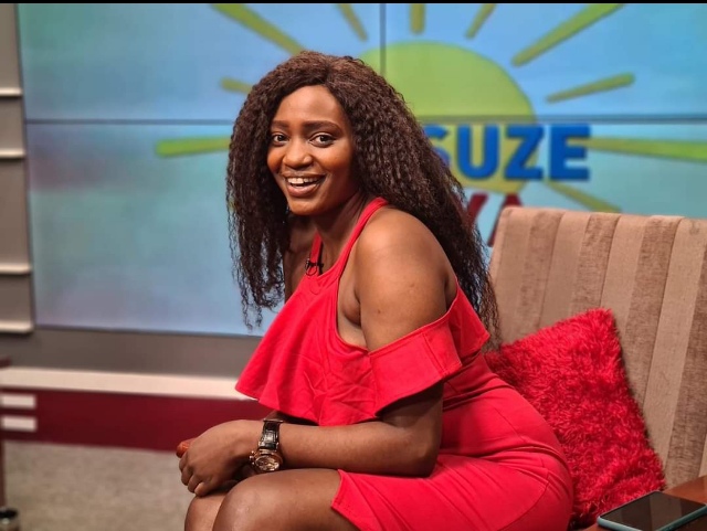 Bukedde TV Presenter Caroline Marcha allegedly serving her goodies to singer Zulitums